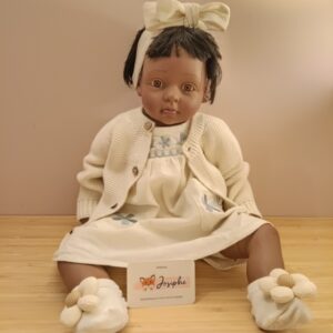 Wit jurkje met blauwe bloem en haarlint